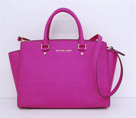 michael kors purse hot pink|Michael Kors pink suitcase.